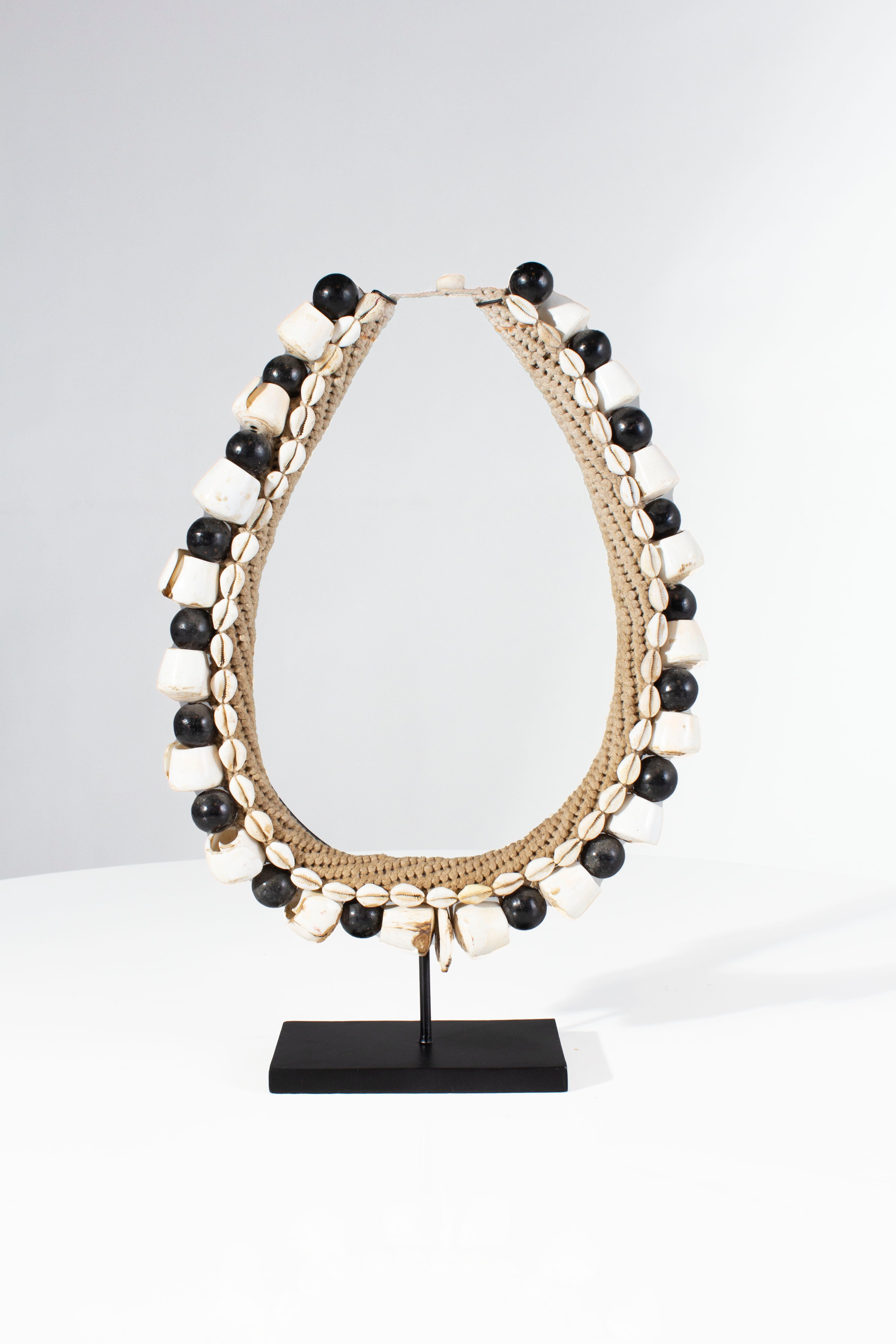 Black Shell Necklace Accessory on Stand
