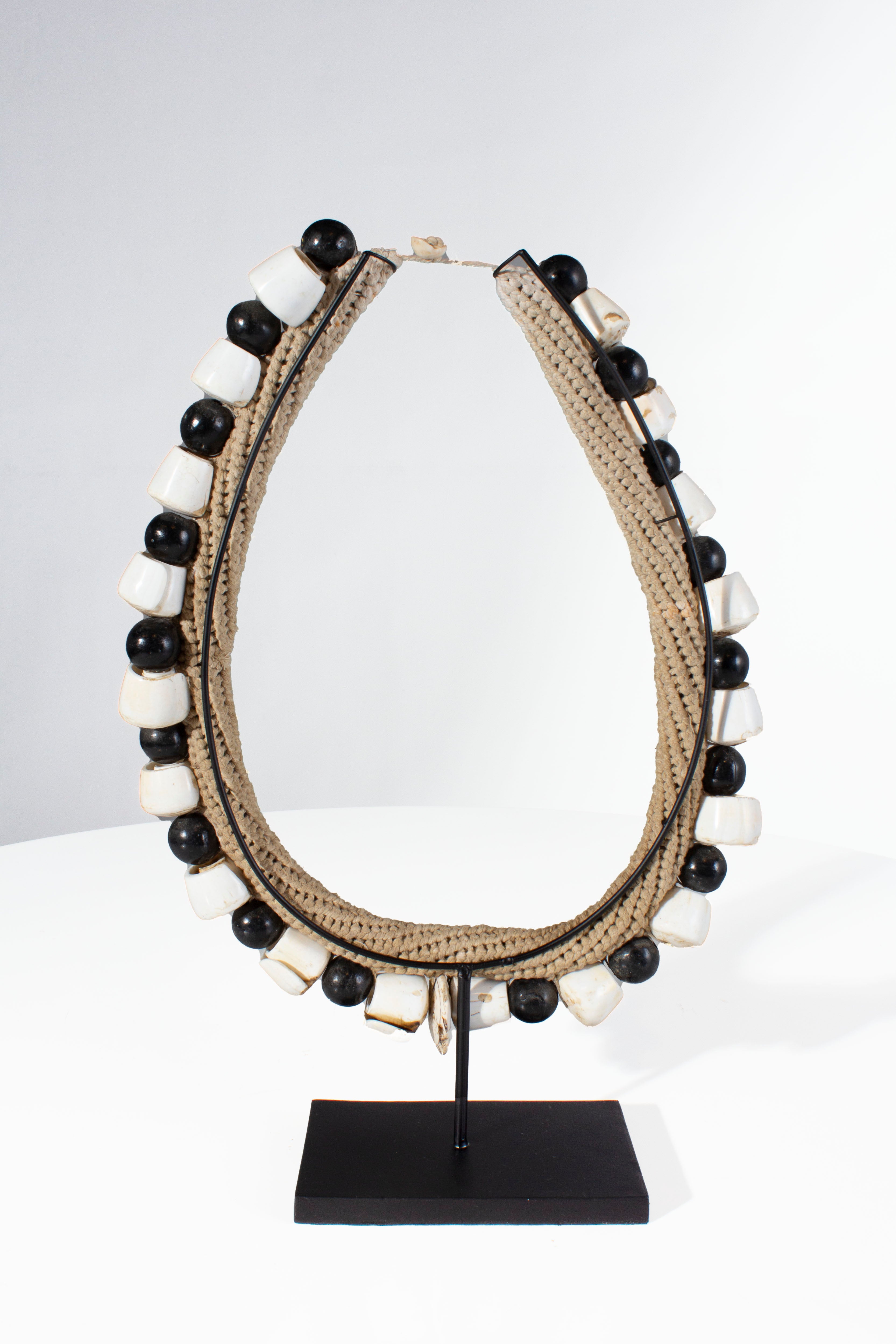 Black Shell Necklace Accessory on Stand